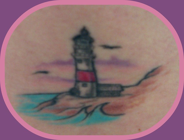 My Lighthouse Tattoo. The outline w/ only the red stripe was done in either 