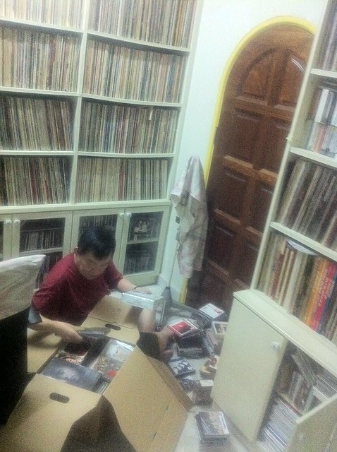 Dad going through Zeg Zeg's record collection