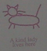 A kind lady lives here (hobo sign)