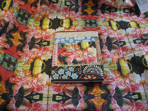 finished journal on top of fabric I made with Spoonflower