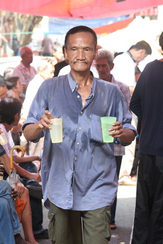 This gentlemen managed to get hold of the glasses of water before the food being distributed 