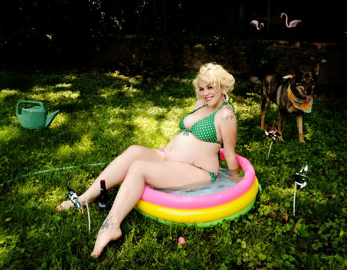 A plus size woman sitting on a Baby Pool