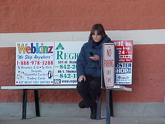 Candid Shot of a Girl Text Messaging on Her Cell Phone. by msmudcat2001