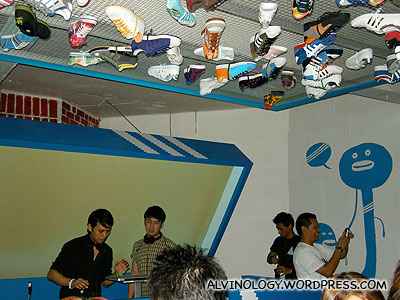Adidas sneakers stuck to the ceiling