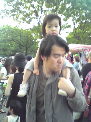 Cute little girl carried by her dad