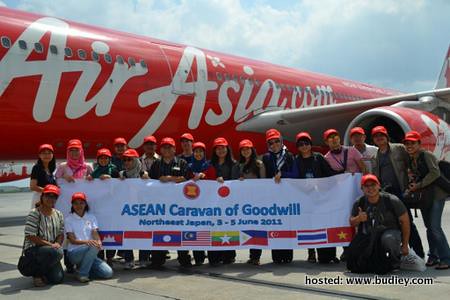 Participants of ASEAN Youth Caravan of Goodwill pose in front of AirAsia X D72652 bound for Haneda, Japan