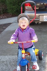 testing out her new tricycle