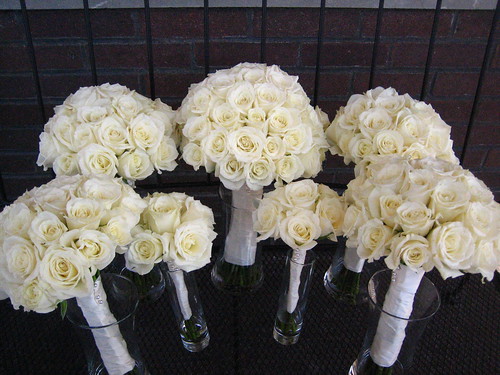 Here are rose bouquets for the wedding I love the ribbon wrapped stems