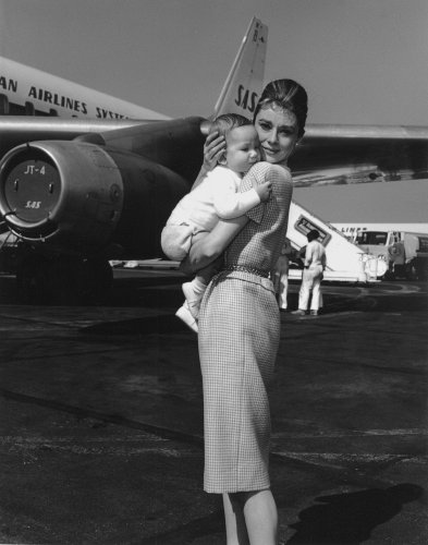 Audrey Hepburn Holding Baby Son Sean Near Airplane