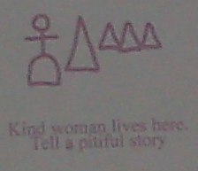 Kind woman lives here. Tell a pitiful story (hobo sign)