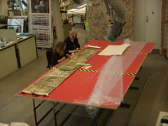 Conservation work on a section of a 19th photograph of the Bayeux Tapestry, February  2009.