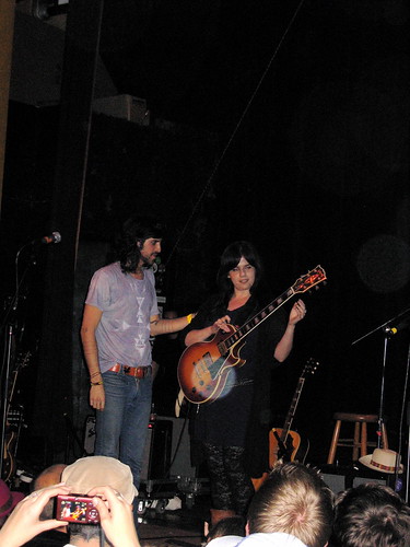 Devendra Hands His Gibson to Yolana 