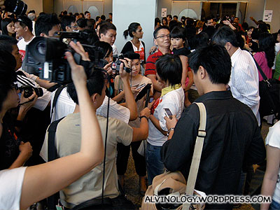 Lots of reporters and cameramen milling outside the conference hall