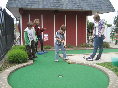 The kids dive into mini-golf when ice skating and roller skating didn't pan out.