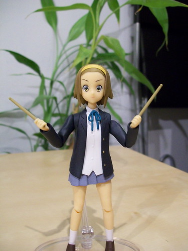 Ritsu holding her drum sticks