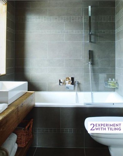 Varying sized tiles in uniform taupe via Living Etc