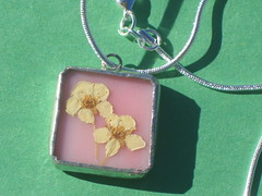 pink pendant with yellow flowers