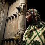 Miss Latifa in front of Zanzibar old door, Tanzania