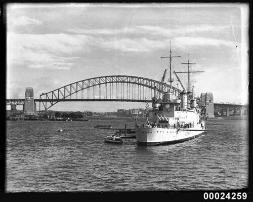 Arrival of the American warship USS Astoria into Farm Cove, Sydney Harbour. Sydney Harbour Bridge in background