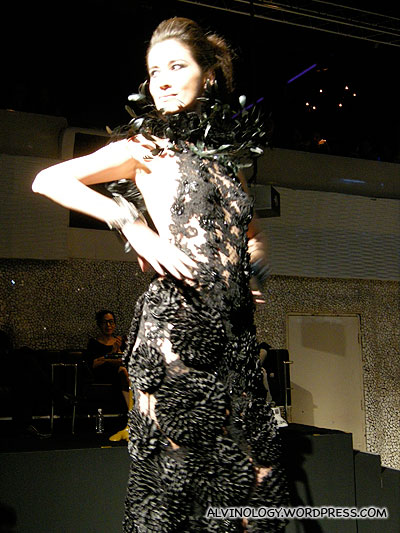 The emcee modeling a lacey black gown herself