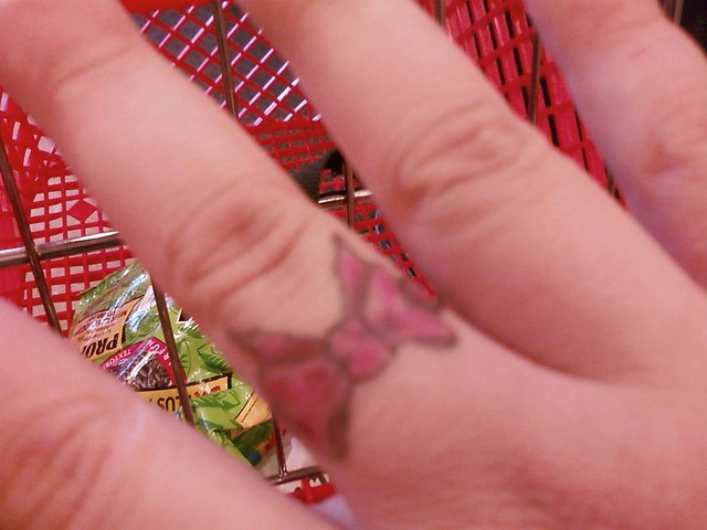 Bow tattoo on my RT middle finger. I love this tattoo, it means a lot to me.