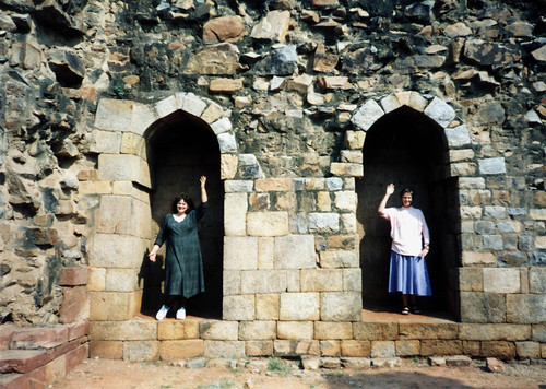 Linda Lane and Virginia Johnson being the statues that aren't in their porticos, stone walls, on pilgrimage, Old Delhi, India by Wonderlane