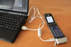 The EEEPC (or other USB port) can charge a cellphone