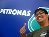 cheesy pose in front of the Petronas logo by hyperren