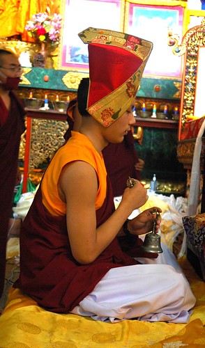 Sakya Prince - Lama HE Avikritar Rinpoche prays holding dorje and drilbu (vajra, a ritual scepter and bell), monks, throne, shrine, Sakya Lamdre, Tharlam Monastery, Bodha, Kathmandu, Nepal by Wonderlane