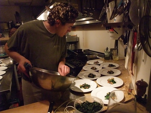 Art of the Table Chef/Owner Dustin Ronspies plates greens and gnocchi before adding the Maritime Nightwatch braised duck leg. Yum. 
