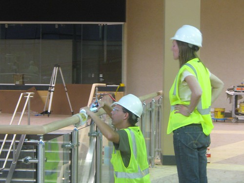 Camille installing, with Alan B. Davidson, the interactive touch railing for her latest project at the West End in St. Louis Park, MN