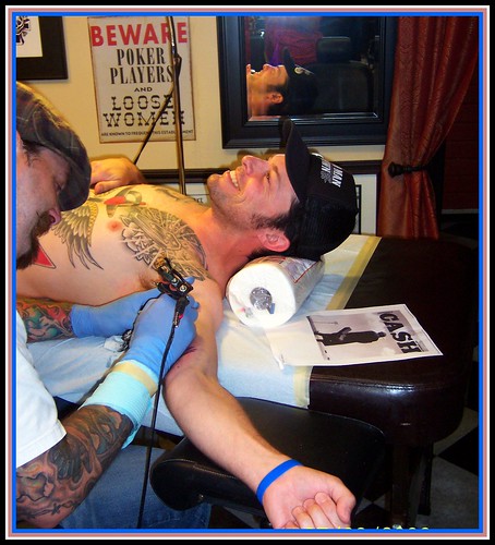 Kevin getting his Johnny Cash highway tattoo.