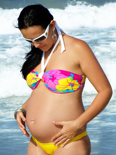 Eight Months pregnant woman in swimwear