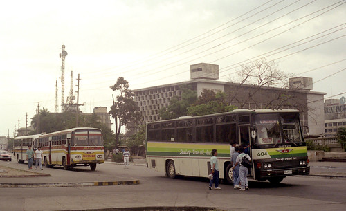 Saulog Transit Inc Hino DGJ-518 (fleet No 604), Trifmann Hino DVS-749 (fleet No 41424) in the Lawton area of Manila, Philippines.
