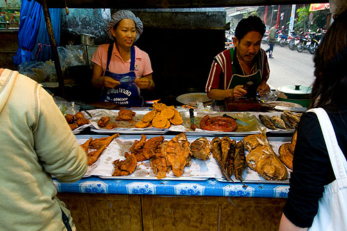 Choosing deep-fried meats to eat with nam phrik and sticky rice, Mae Hong Son's morning market