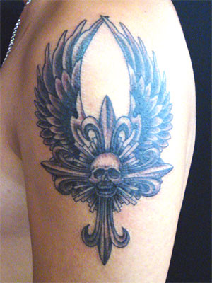 cross tattoo with wing