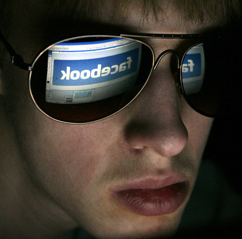 Teen Looking At Facebook