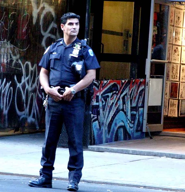 Handsome cop protects St. Marks Place.