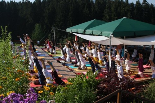 Practicising yoga together on the deck, overlooking the mountains