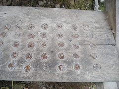 Little Metal Bottle Tops Nailed To The Floor