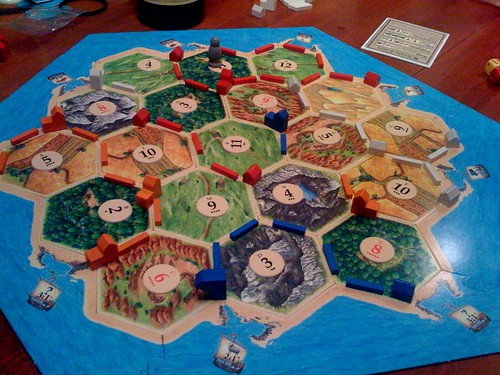 Katie = undefeated two time champion of Settlers of Catan. Just realizing how imporant these 'Development Cards' are.