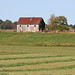 barn with green line fields