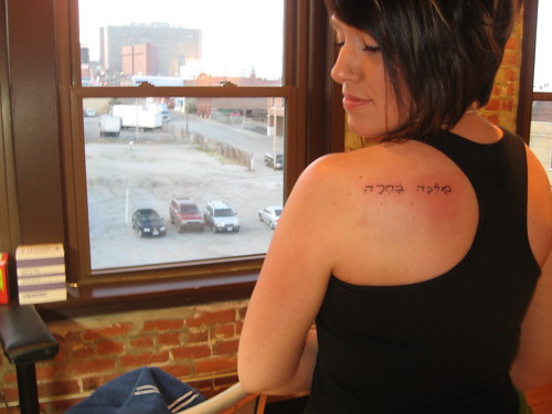 upper back tattoos women. Tattoos text at woman upper