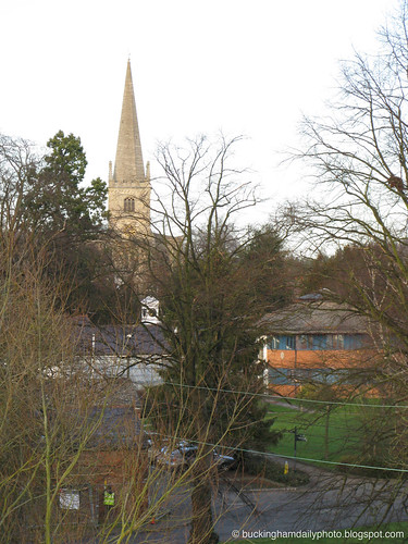 the spire seen through tree branches.