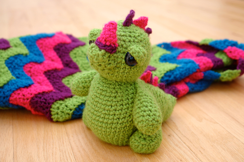 baby dragon with blanket