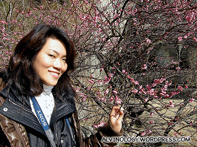 Rachel beside a sakura tree