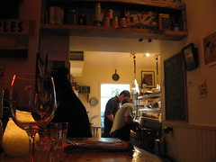 Peeking into the kitchen from the bar