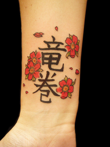  Tornado kanji and camelia flowers tattoo 