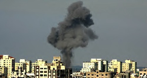 A Gaza explosion from Israeli aerial bombardments of the people. Hamas, the legitimately elected government of the Palestinian Authority, has been villified in the corporate press. by Pan-African News Wire File Photos