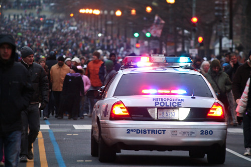 police car and crowds